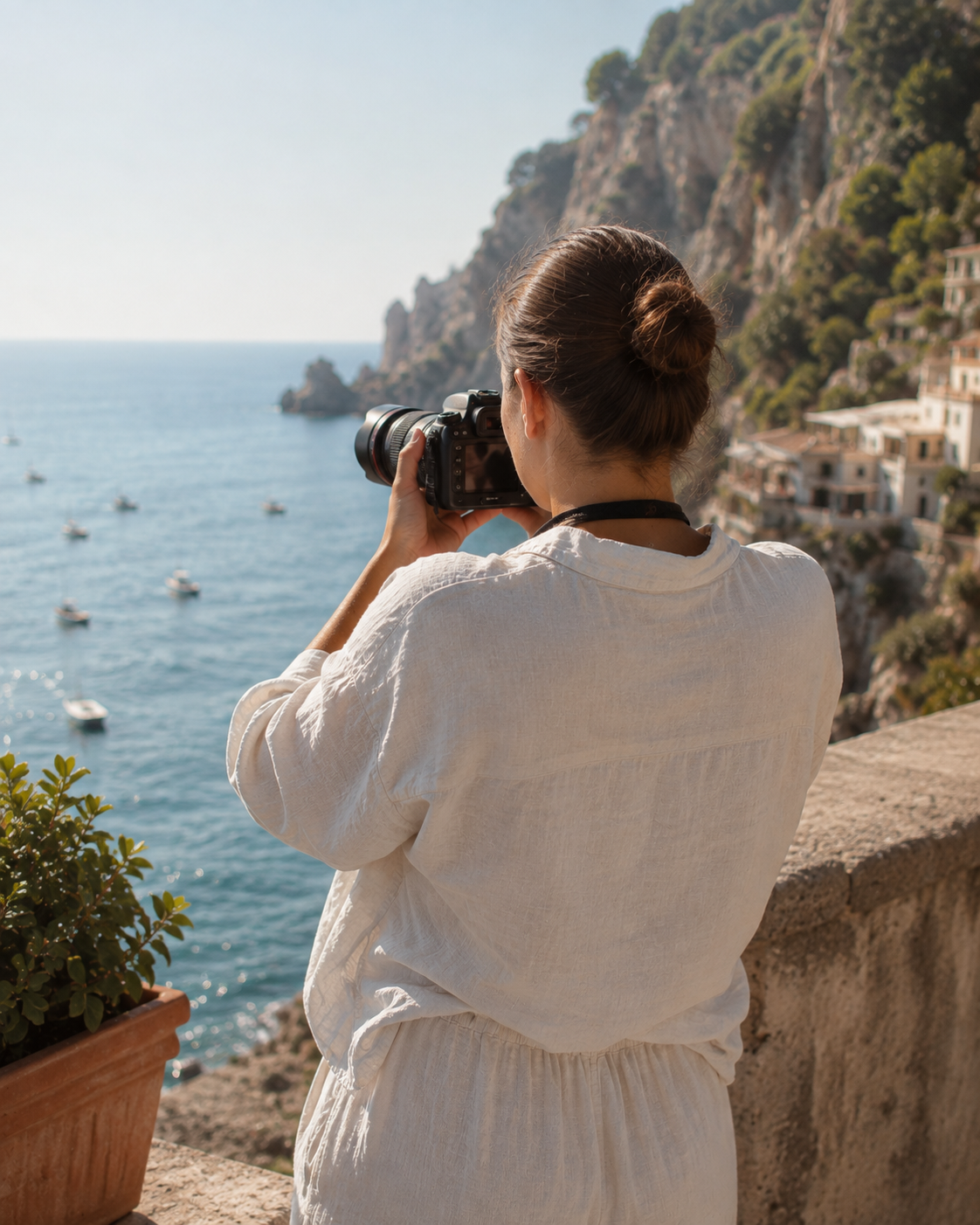 Sonia Anton photographing the Amalfi coast from a terrace